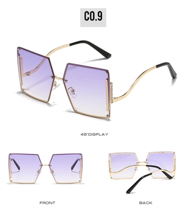 Detail view of rimless rhinestone sunglasses with purple gradient lenses and gold temples