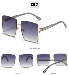 Detail view of gold square sunglasses with purple gradient lenses and striped temples