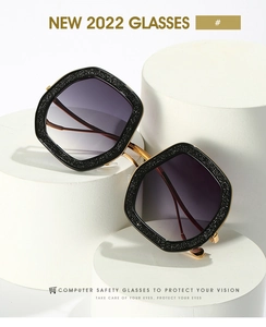 Detail of square oversized glasses with black glitter frames and purple gradient lenses