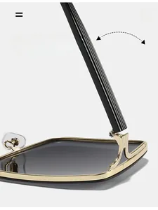 Detailed close-up of a durable golden metal hinge on square sunglasses with dark lenses