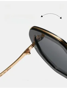 Detail of durable metal hinge on black oval sunglasses with Star Black engraving
