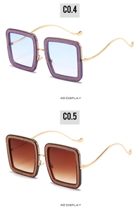 Detailed 45-degree view of square glitter sunglasses with wavy metal temples