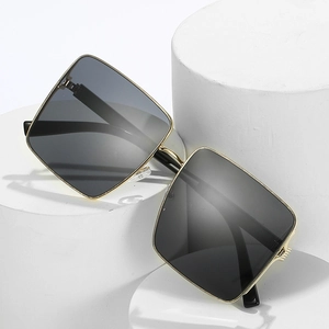 Fashionable square oversized sunglasses with gold metal frame and dark grey gradient lenses