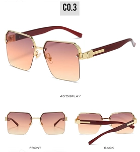 Trois vues de lunettes de soleil demi-cerclées avec verres dégradés marron et monture dorée