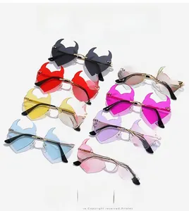 Detail view of heart-shaped devil sunglasses in eight vibrant colors with metal frames