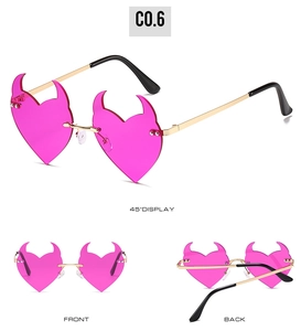 Three-angle view of pink rimless heart sunglasses with stylish devil horn accents