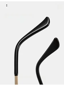 Detail of curved resin temples with gold metal hinges for comfortable sunglass wear
