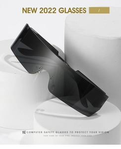 Close-up of black frameless wrap-around sports sunglasses with futuristic shield lens