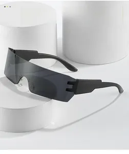 Detail of wraparound rimless sports sunglasses with grey polarized lenses on white stand