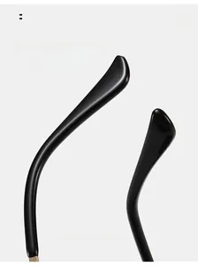 Detail view of ergonomic curved black temples on rimless hip hop style sunglasses