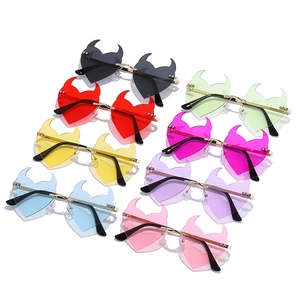Frameless heart shaped devil sunglasses with metal temples in eight vibrant colors