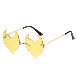 Unique heart shaped devil horn sunglasses with yellow lenses and golden metal frames