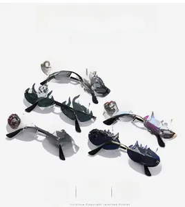 Detail of multi-color flame-shaped rimless sunglasses with metal temples and nose pads