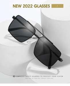 Close-up of black square sunglasses with metal double bridge on white display stand