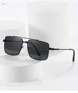 Detail of double bridge metal frame sunglasses with fine textured temples on white stand