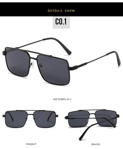 Detail view of square black sunglasses with double bridge metal frame and gray lenses