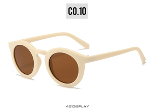 Detail view of cream vintage round sunglasses with brown lenses at a 45-degree angle