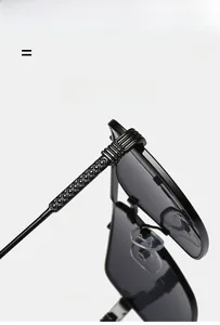 Detailed close-up of flexible temples and embossed geometric texture on square sunglasses