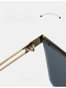 Detailed macro view of durable gold-plated metal hinges on oversized square sunglasses