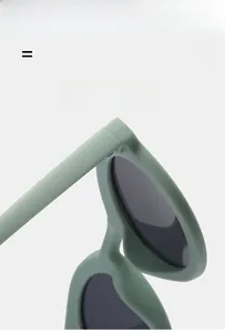 Detailed view of durable hinge structure on light green matte retro sunglasses