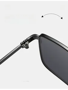 Close-up of durable reinforced metal hinges and black frame on retro square sunglasses