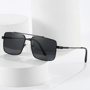 Retro double bridge aviator sunglasses with black metal frame on white display pedestals