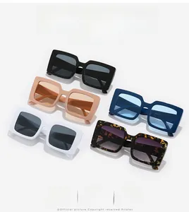 Flat lay of vintage rectangular oversized sunglasses in five diverse stylish colors