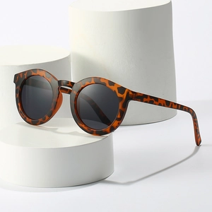 Retro round leopard tortoise shell sunglasses with dark gray lenses for fashion styling