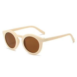 Retro cream round sunglasses with tinted brown lenses for stylish UV protection