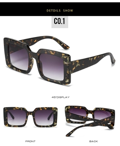 Close-up of tortoise shell square oversized sunglasses with gradient purple lenses