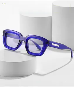 Detail of rectangular blue acetate sunglasses with silver temple metal accents