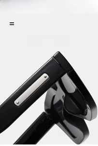Detail of black sunglasses frame with silver metal inlay and dual rivet accents