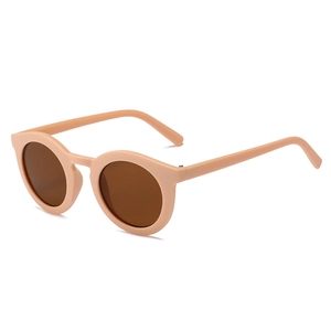 Retro round kids sunglasses in matte pale pink frame with dark brown lenses for boys and girls