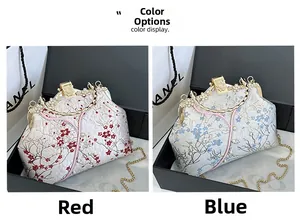 Close-up of vintage floral embroidery handbags in red and blue with pearl clasp