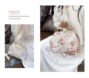 Detail view of floral embroidery and pearl accents on vintage satin handbag