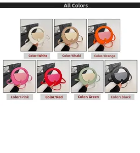 Flat lay of seven colorful round crossbody bags in white khaki orange rose green red and black