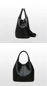 Detail shots of the black lychee pattern leather tote bag from front and back views