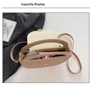 Internal capacity view of camel PU handbag showing phone and wallet storage space