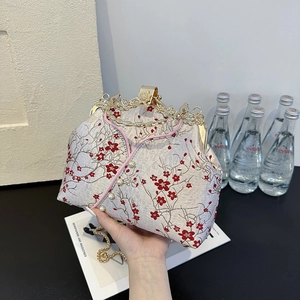 Elegant Chinese style embroidered evening handbag with red plum blossoms and pearl details