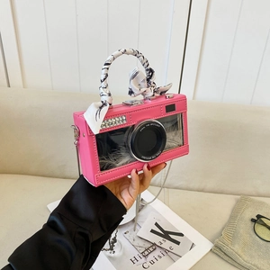 Pink camera-shaped handbag with silk scarf handle and white feather filling design