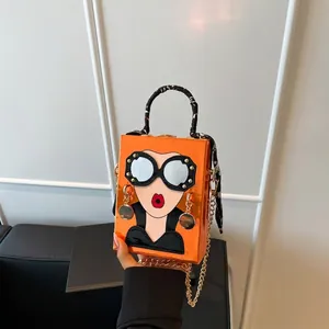 Sac à main rigide orange original avec motif visage artistique et foulard en soie