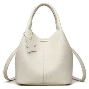 White lychee pattern leather bucket bag with minimalist bear charm and dual shoulder straps