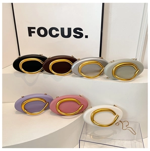 Chic oval chain bags in seven colors featuring a large golden metal buckle and sleek design