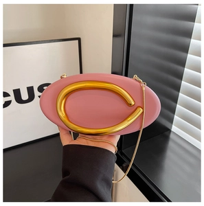 Pink oval evening clutch bag with large gold metal ring handle and fine gold chain strap