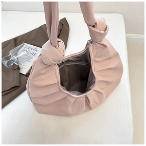 Pink pleated cloud bag with soft interior lining and internal zipper pocket detail