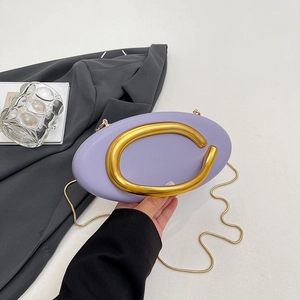 Lavender oval leather evening bag with a gold ring buckle and a slim metal chain