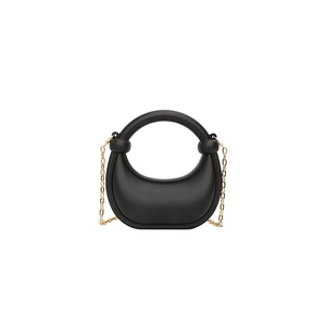 Elegant black crescent hobo bag with a gold chain strap and a matte leather finish