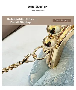 Detail of light blue jacquard shell bag with gold metal frame and detachable chain hook