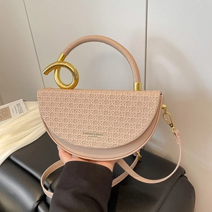 Elegant beige quilted saddle bag with golden knot hardware and top handle for women