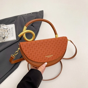 Brown woven leather saddle bag with gold knotted handle and adjustable strap for women